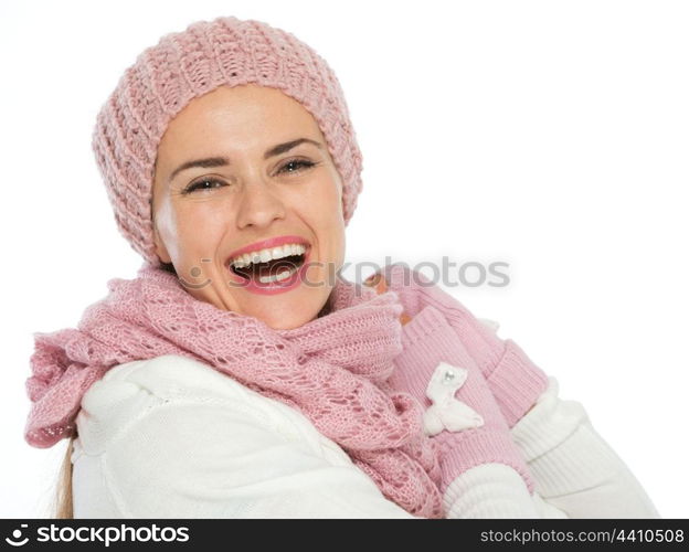 Portrait of smiling woman in knit scarf, hat and mittens