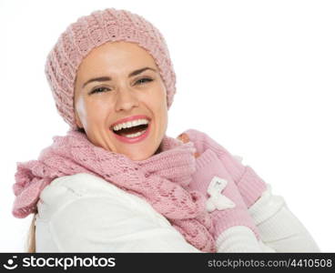 Portrait of smiling woman in knit scarf, hat and mittens