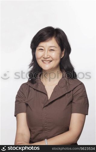 Portrait of smiling woman, studio shot