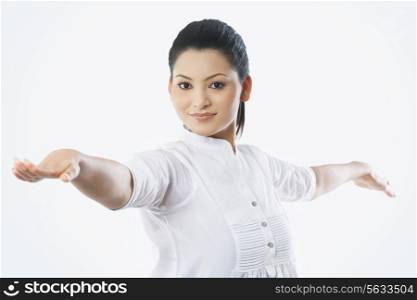Portrait of smiling woman with arms outstretched