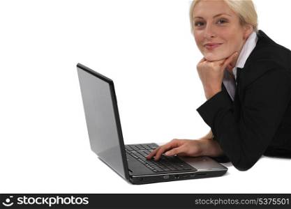 Portrait of smiling woman with computer