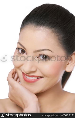 Portrait of smiling woman with hand on chin