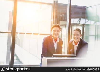 Portrait of smiling young attractive passenger service agent standing in airport