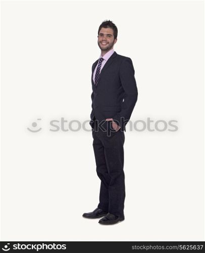 Portrait of smiling young businessman with hands in his pockets, studio shot, full length