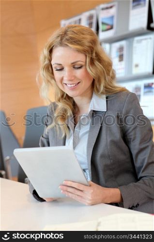 Portrait of smiling young businesswoman in office