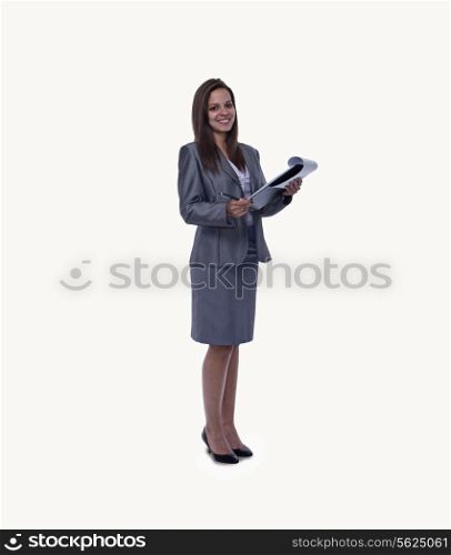 Portrait of smiling young businesswoman with an open note pad, full length, studio shot