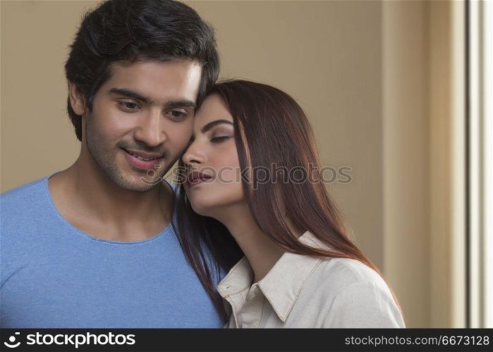 Portrait of smiling young couple hugging