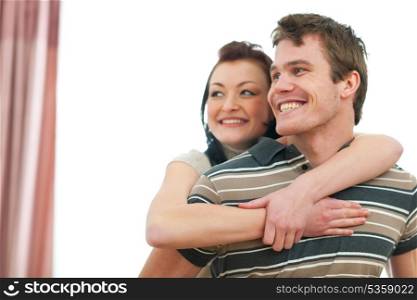 Portrait of smiling young couple looking on copyspace