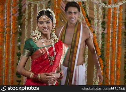 Portrait of smiling young couple on their wedding day