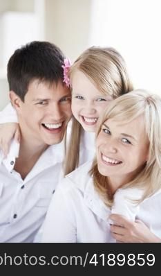 Portrait of smiling young family closeup