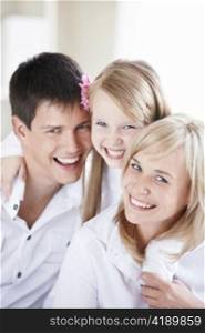 Portrait of smiling young family closeup