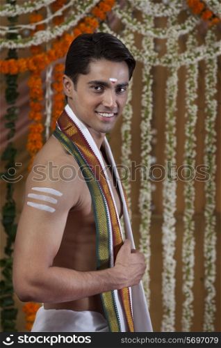 Portrait of smiling young groom wearing traditional Indian clothing