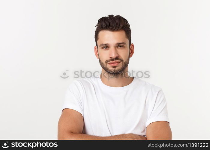 Portrait of smiling young man in a white t-shirt isolated on white background. Portrait of smiling young man in a white t-shirt isolated on white background.