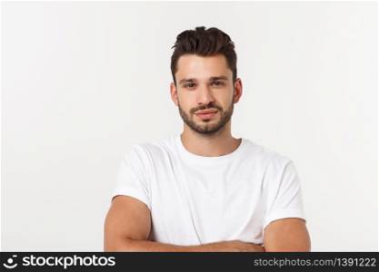Portrait of smiling young man in a white t-shirt isolated on white background. Portrait of smiling young man in a white t-shirt isolated on white background.