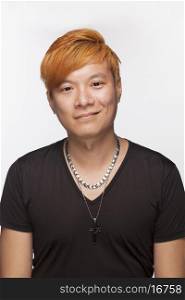 Portrait of smiling young man with orange hair