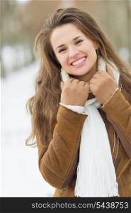 Portrait of smiling young woman in winter outdoors