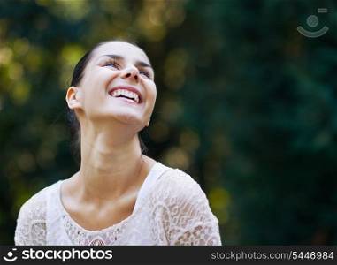 Portrait of smiling young woman in woods