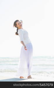 Portrait of smiling young woman on beach