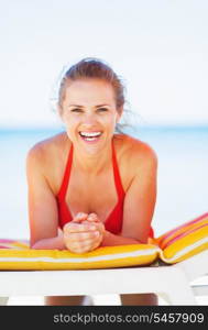 Portrait of smiling young woman on beach