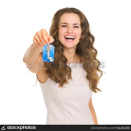 Portrait of smiling young woman showing house key