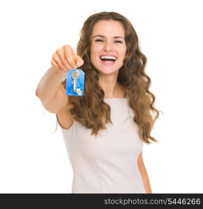 Portrait of smiling young woman showing house key