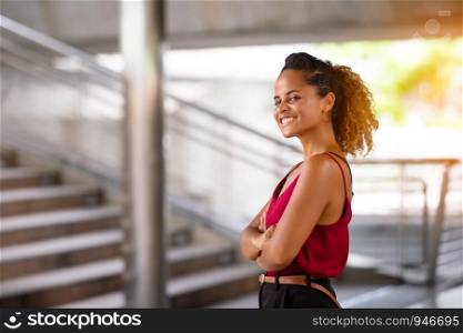 Portrait Of Smiling Young Woman with confident standing outdoor