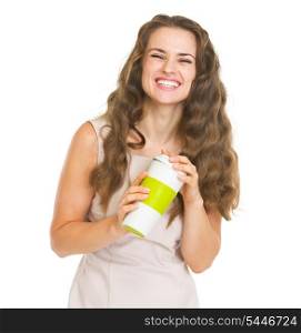 Portrait of smiling young woman with cup of hot beverage