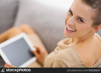 Portrait of smiling young woman with tablet pc