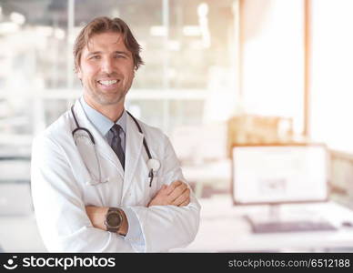 Portrait of smilling senior doctor of medicine in his ordination. Senior doctor of medicine in his ordination