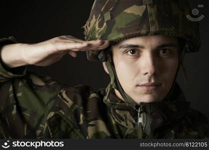 Portrait Of Soldier In Uniform Saluting