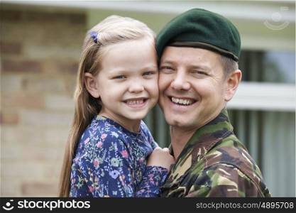 Portrait Of Soldier On Leave Hugging Daughter