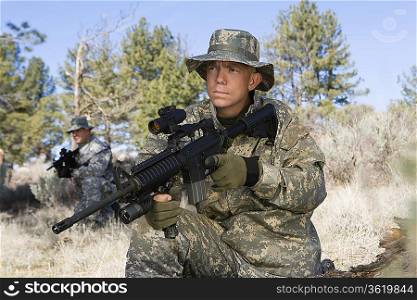 Portrait of soldier with machine gun