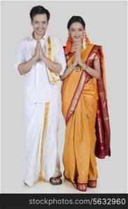 Portrait of South Indian couple greeting