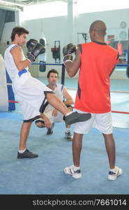 portrait of sport people doing kick boxing