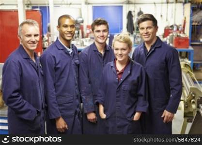 Portrait Of Staff Standing In Engineering Factory