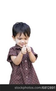 Portrait of standing beautiful Asian Thai little boy giving you thumbs up isolated on white background