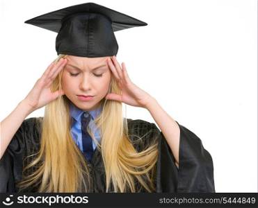 Portrait of stressed young woman in graduation gown