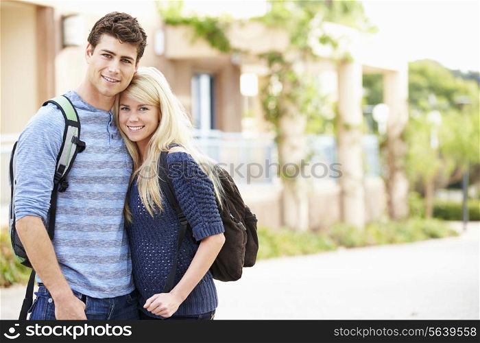 Portrait Of Student Couple Outdoors On University Campus