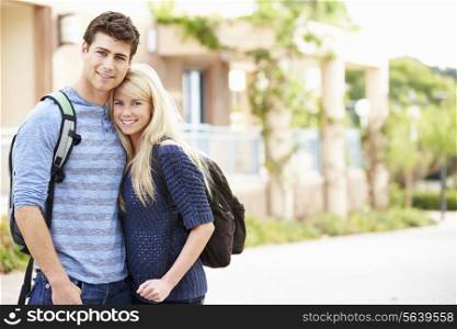 Portrait Of Student Couple Outdoors On University Campus