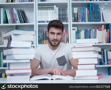 portrait of student in collage school library, arab youth learning and reading book