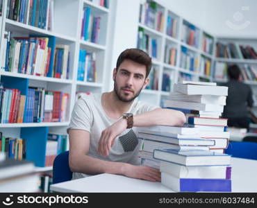 portrait of student in collage school library, arab youth learning and reading book