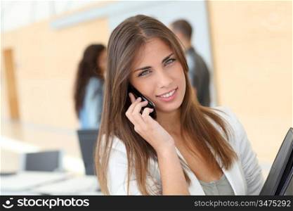 Portrait of student talking on mobile phone