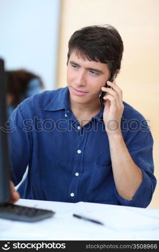 Portrait of student using mobile phone in class