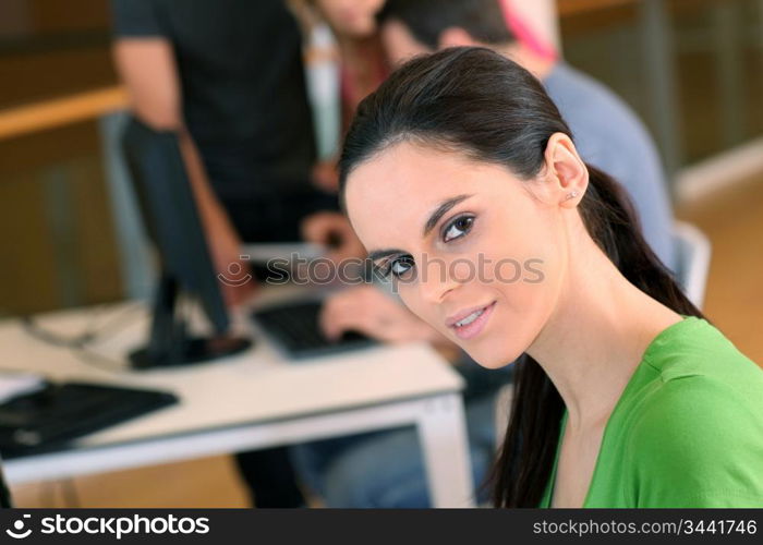 Portrait of student working on desktop computer