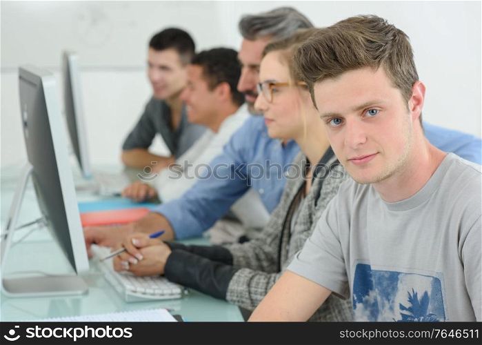 portrait of students using computers