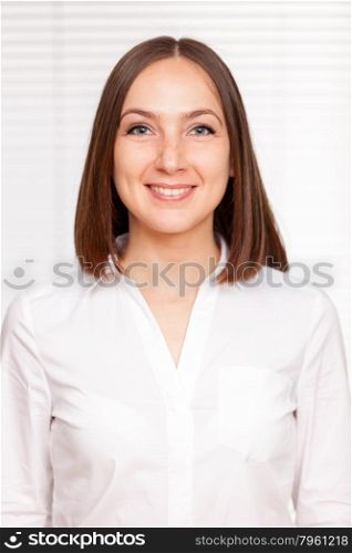 Portrait of successful brunette businesswoman over white isolated background
