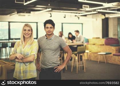 Portrait Of Successful Business couple Entrepreneur At Busy startup Office