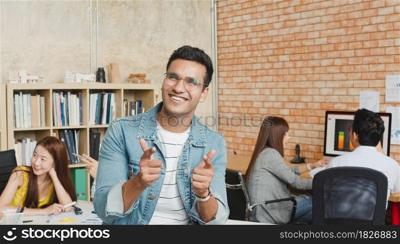 Portrait of successful handsome executive businessman smart casual wear looking at camera and smiling, happy in modern office workplace. Young Asia guy standing relax in contemporary meeting room.