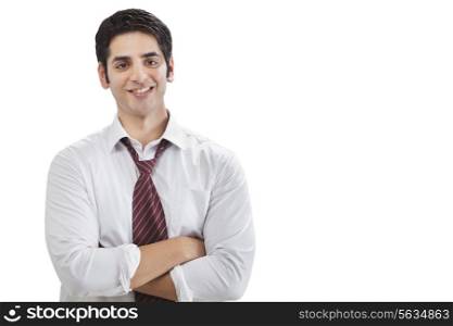 Portrait of successful young businessman with arms crossed
