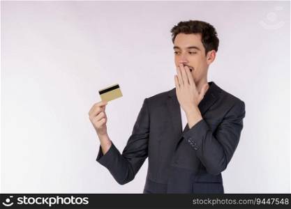 Portrait of Surprised businessman showing credit card isolated over white background. Online shopping, ecommerce, internet banking, spending money concept.